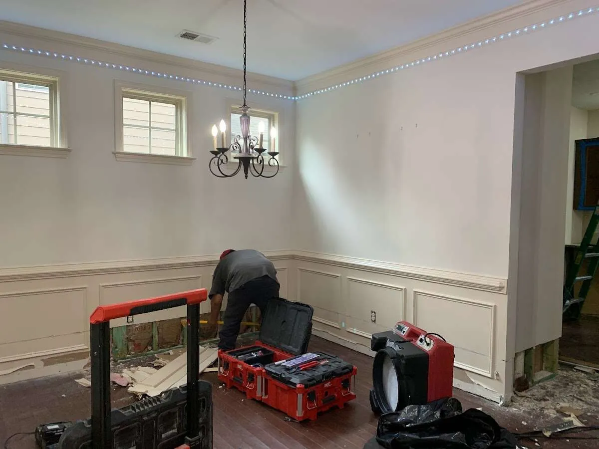 Restoration technician with professional equipment in West Haven